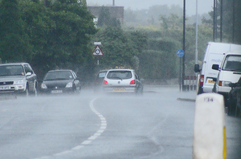 Vehicles Driving on Wet Road