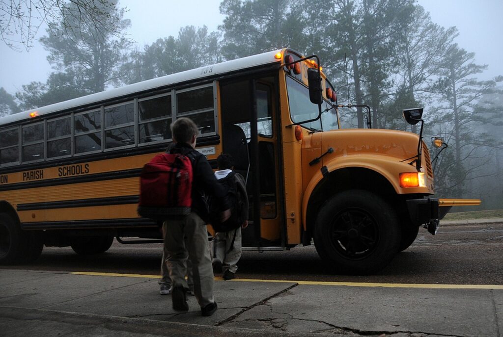 Children boarding a school bus